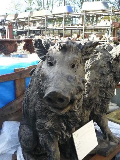 Two wild boar statues