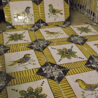 Hand painted bird and patterned tiles