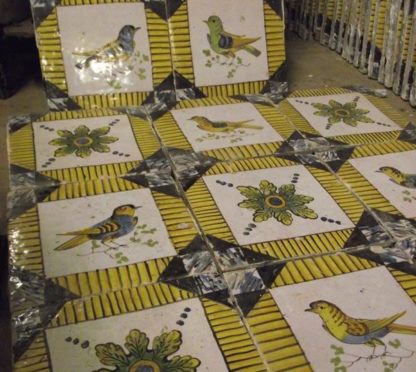 Hand painted bird and patterned tiles